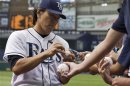Tampa Bay Rays' Matsui signs autographs before a MLB American League baseball game against the New York Mets in St. Petersburg, Florida