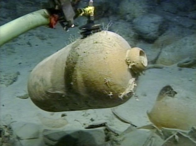 Handout photo of a Spanish olive jar being recovered using the limpet suction device from the Tortugas shipwreck, in the Straits of Florida