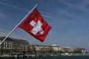 A Swiss flag is pictured on the Mont-Blanc bridge over Lake Leman in Geneva