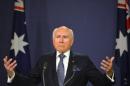 Former Australian prime minister John Howard speaks at a press conference in Sydney, where he defended his decision to go to war with Iraq alongside the United States and Britain in 2003