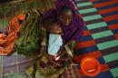 Diawara holds her daughter Diarra, as she recovers from malnutrition, at nutrition center run by Accion contra el Hambre at Selibaby's hospital