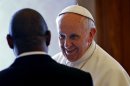 Pope Francis, right, meets with Mozambique's Prime Minister Alberto Vaquina on the occasion of their private audience in the pontiff's library, at the Vatican, Thursday, April 11, 2013. (AP Photo/Alessandro Di Meo, pool)