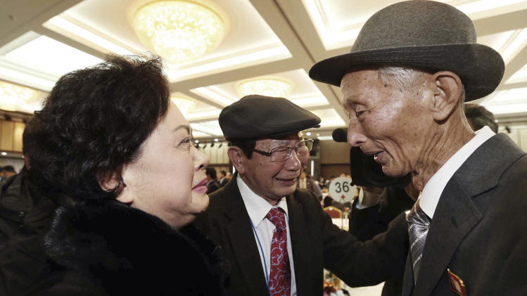 North Korean Nam Gung Ryuck, right, meets with South Korean daughter Nam Gung Bong-ja during the Separated Family Reunion Meeting at Diamond Mountain resort in North Korea, Sunday, Feb. 23, 2014. Elderly North and South Koreans separated for six decades are tearfully reuniting, grateful to embrace children, brothers, sisters and spouses they had thought they might never see again. (AP Photo/Yonhap, Lee Ji-eun) KOREA OUT