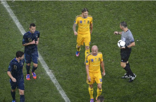 Match referee Kuipers of Netherlands, France's Nasri, Menez , Ukraine's Voronin and Nazarenko leave the pitch due to heavy rain during their Group D Euro 2012 soccer match at Donbass Arena in Donetsk