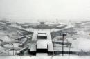 Airplanes stand in the snow at O'Hare International Airport on Sunday, Feb. 1, 2015, in Chicago. A slow-moving winter storm blanketed a large swath of the Plains and Midwest in snow Sunday, forcing the cancellation of more than 1,500 flights, making roads treacherous and forcing some people to rethink their plans to attend Super Bowl parties. (AP Photo/Nam Y. Huh)