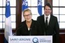 Parti Quebecois leader Marois smiles after introducing her new candidate Peladeau, former president and CEO of Quebecor Inc., in Saint-Jerome, Quebec