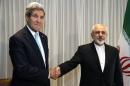 U.S. Secretary of State John Kerry shakes hands with Iranian Foreign Minister Mohammad Javad Zarif before a meeting in Geneva