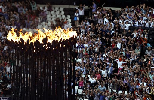 The Olympic flame burns as spectators gather in Olympic Stadium to attend the Closing Ceremony at the 2012 Summer Olympics, Sunday, Aug. 12, 2012, in London. (AP Photo/Hassan Ammar)
