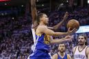 Golden State Warriors guard Stephen Curry, front, shoots in front of Oklahoma City Thunder forward Serge Ibaka, left, and center Steven Adams (12) during the first half in Game 4 of the NBA basketball Western Conference finals in Oklahoma City, Tuesday, May 24,, 2016. The Thunder won 118-94. (AP Photo/Sue Ogrocki)