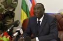 Central Africa's interim leader Michel Djotodia gives a statement to the press at his Bangui residence on December 21, 2013