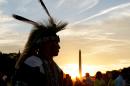 FILE - In this Tuesday, Sept. 21, 2004 photo, a member of the Northern Arapaho Tribe who lives on the Wind River Indian Reservation in Wyoming, attends the festivities on the National Mall for the opening of the National Museum of the American Indian in Washington. The Washington Monument is in the background. Federal agencies questioned how the Northern Arapaho government spent at least $3.4 million since 2007, but decided not to recover any of the money - and even increased funding. The Wyoming tribe is hardly unique. An Associated Press review of summaries of audits performed by private firms showed that auditors consistently raised serious concerns about 124 of 551 tribal governments, schools or housing authorities that received at least 10 years of substantial federal funds since 1997. (AP Photo/Susan Walsh, File)