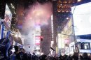 Revellers usher in the new year at midnight during New Year's Eve celebrations at Times Square in New York