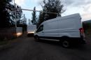 Forensic service vans arrive at the ranch where gunmen took cover during an intense gun battle with the police, along the Jalisco-Michoacan highway in Vista Hermosa, Michoacan State, on May 22, 2015