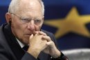 German Finance Minister Schaeuble listens to a news conference in the Greek ministry of finance in Athens