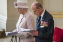 Britain's Prince Phillip, Duke of Edinburgh and Britain's Queen Elizabeth II attend a Service of Commemoration at St Martin-in-the-Fields church in central London on August 15, 2015, to mark the 70th anniversary of VJ (Victory over Japan) Day