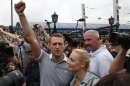 Russian protest leader Alexei Navalny addresses his supporters after arriving from Kirov at a railway station in Moscow