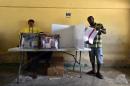 A man votes at a polling station during legislative elections in Port-au-Prince, Haiti on August 9, 2015