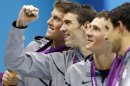 United States' Conor Dwyer, left, Michael Phelps, center, Ryan Lochte, second right, and Ricky Berens, right, pose with their gold medals after their win in the men's 4 x 200-meter freestyle relay at the Aquatics Centre in the Olympic Park during the 2012 Summer Olympics in London, Tuesday, July 31, 2012. (AP Photo/Daniel Ochoa De Olza)
