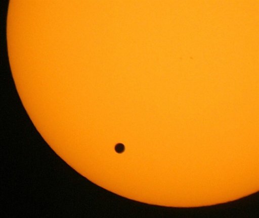 FILE - This June 8, 2004 file photo shows the transit of Venus, which occurs when the planet Venus passes between the Earth and the Sun, is pictured in Hong Kong. Venus will cross the face of the sun on Tuesday June 5, 2012, a sight that will be visible from parts of Earth. This is the last transit for more than 100 years. (AP Photo/Vincent Yu,File)