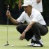 President Obama lines up a putt on first green at Andrews Air Force Basi in Maryland