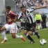 AC Milan's Urby Emanuelson is challenged by Udinese's Allan Marques Loureiro during their Serie A soccer match at Friuli stadium in Udine