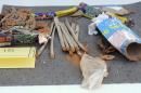 This undated law enforcement agency photo released by the U.S. Attorney's Office and presented as government evidence Friday, July 11, 2014, during the trial of Azamat Tazhayakov in U.S. District Court in Boston, shows items that had been retrieved from a landfill in New Bedford, Mass. during the investigation of the Boston Marathon bombing. Tazhayakov, a friend of bombing suspect Dzhokar Tsarnaev, is on trial on obstruction of justice charges, accused with another friend of removing items from Tsarnaev's dorm room. He is not charged with participating in the bombing or knowing about it in advance. (AP Photo/U.S. Attorney's Office)