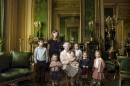 Britain's Queen Elizabeth II poses with her five great-grandchildren and her two youngest grandchildren in the Green Drawing Room, part of Windsor Castle's semi-State apartments