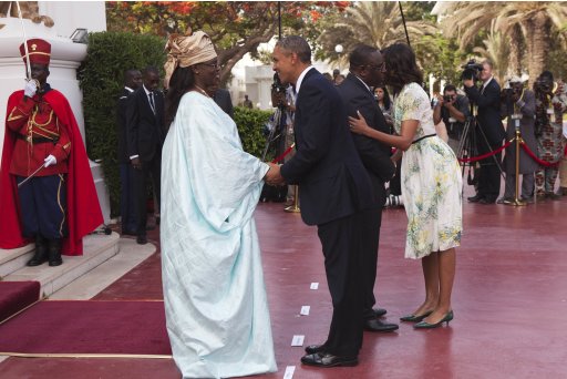 U.S. President Obama greets Senegalese First Lady Faye Sall as Senegalese President Sall greets U.S. first lady Michelle at presidential palace in Dakar