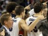 Gonzaga's coach Mark Few, left, celebrates with his team after their West Coast Conference Championship win in an NCAA college basketball game against Portland, Saturday, March 2, 2013, in Spokane, Wash. Gonzaga defeated Portland 81-52. (AP Photo/Jed Conklin)