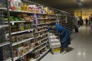 A woman looks for supplies at a Waldbaums grocery store in Long Beach, New York