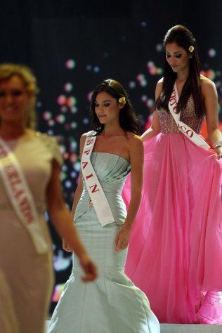 Miss Spain Elena Ibarbia Jimenez, and Miss Puerto Rico Nadyalee Torres walk on stage during the opening of the 63rd Miss World Pageant ceremony in Nusa Dua, Bali, Indonesia on Sunday, Sept. 8, 2013. (AP Photo/Firdia Lisnawati)