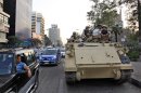 Egyptian army soldiers sit on top of an armored personnel carrier on a street in Cairo, Egypt, Saturday, Sept. 7, 2013. (AP Photo/Khalil Hamra)