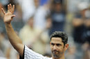 FILE - In this Sept. 25, 2011, file photo, New York Yankees batter Jorge Posada takes a curtain call after hitting a two-run home run during the third inning of the first game of a baseball doubleheader against the Boston Red Sox at Yankee Stadium in New York. The Yankees say Posada is going to announce his retirement Tuesday, Jan. 24, 2012 at Yankee Stadium. The 40-year-old five-time All-Star catcher will end his 17-year big league career with the team that drafted him rather than pursue another team. The Yankees announced Posada's decision in a statement Monday, Jan. 23, 2012. (AP Photo/Bill Kostroun, File)