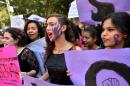Women in Mexico City take part on October 19, 2016 in a march in solidarity for the brutal killing of a 16-year-old girl in Argentina where protesters held a one-hour "women's strike