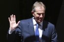 Former Prime Minister Tony Blair waves as he leaves a Diamond Jubilee lunch with Britain's Queen Elizabeth in central London