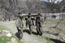 PKK fighters stand guard at the Qandil mountains in Sulaimaniya