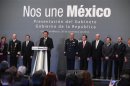 Miguel Angel Osorio Chong, newly appointed Interior Minister, addresses the audience during the presentation of Mexico's incoming President Enrique Pena Nieto's cabinet in Mexico City