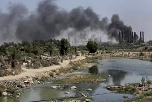 Smoke rises from the Gaza power plant after it was &hellip;