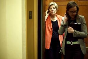 Warren speaks on the phone as she arrives for the weekly&nbsp;&hellip;