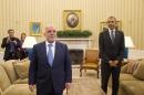 Iraqi Prime Minister Haider Al-Abadi and President Barack Obama walk through the Oval Office of the White House in Washington, Tuesday, April 14, 2015, following their meeting. The Prime Minister's visit is to discuss U.S.-Iraq policy and the fight against the IS group. (AP Photo/Jacquelyn Martin)
