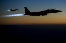 A pair of U.S. Air Force F-15E Strike Eagles fly over northern Iraq