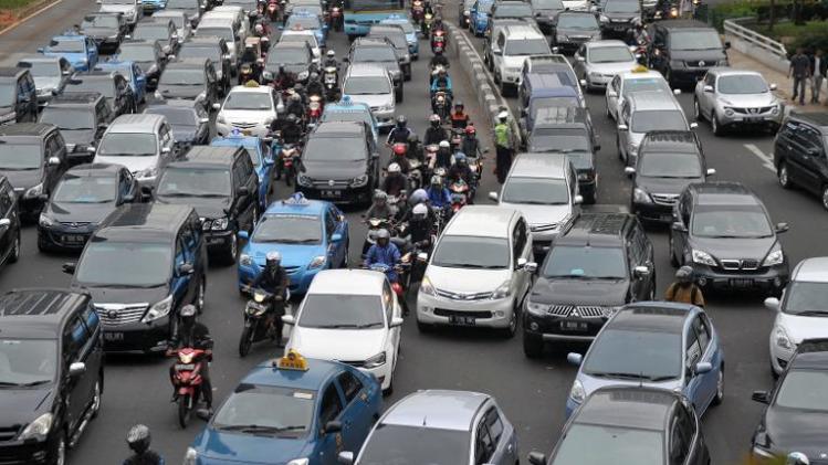 Motorists are trapped in the rush-hour gridlock in Jakarta, on October 21, 2013