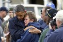 President Barack Obama, left, embraces Donna Vanzant, right, during a tour of an area effected by superstorm Sandy, Wednesday, Oct. 31, 2012, in Brigantine, N.J. Vanzant is a owner of North Point Marina, which was damaged by the storm. (AP Photo/Pablo Martinez Monsivais)