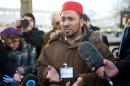 Ajmal Masroor speaks to the media outside the Harrow Central mosque in Harrow, west London on December 13, 2009