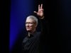 Apple CEO Tim Cook waves at the end of Apple Inc.'s iPhone media event in San Francisco