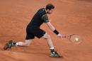 British tennis player Andy Murray returns a ball to Japanese tennis player Kei Nishikori during the men's semifinal of the Madrid Open tournament at the Caja Magica sports complex in Madrid on May 9, 2015