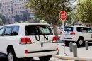 UN vehicles leave the Four Season Hotel in Damascus, Syria, Thursday, Aug. 29, 2013. U.N. experts investigating purported poison gas attacks left their Damascus hotel Thursday, but anti-regime activists said the team's destination was not immediately known. (AP Photo)