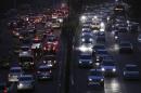 Heavy traffic moves along a busy road during the evening in New Delhi