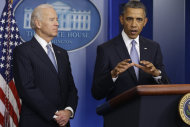 <p>               President Barack Obama and Vice President Joe Biden make a statement regarding the passage of the fiscal cliff bill in the Brady Press Briefing Room at the White House in Washington, Tuesday, Jan. 1, 2013. (AP Photo/Charles Dharapak)