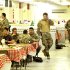 Britain's Prince Harry walks in the dining facility at Camp Bastion, southern Afghanistan